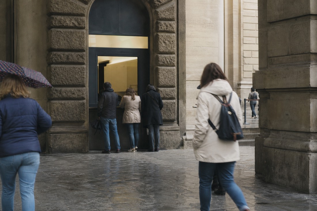 Ticket office window in a Florentine stone doorway at Via Ricasoli 60 next to the Accademia entrance